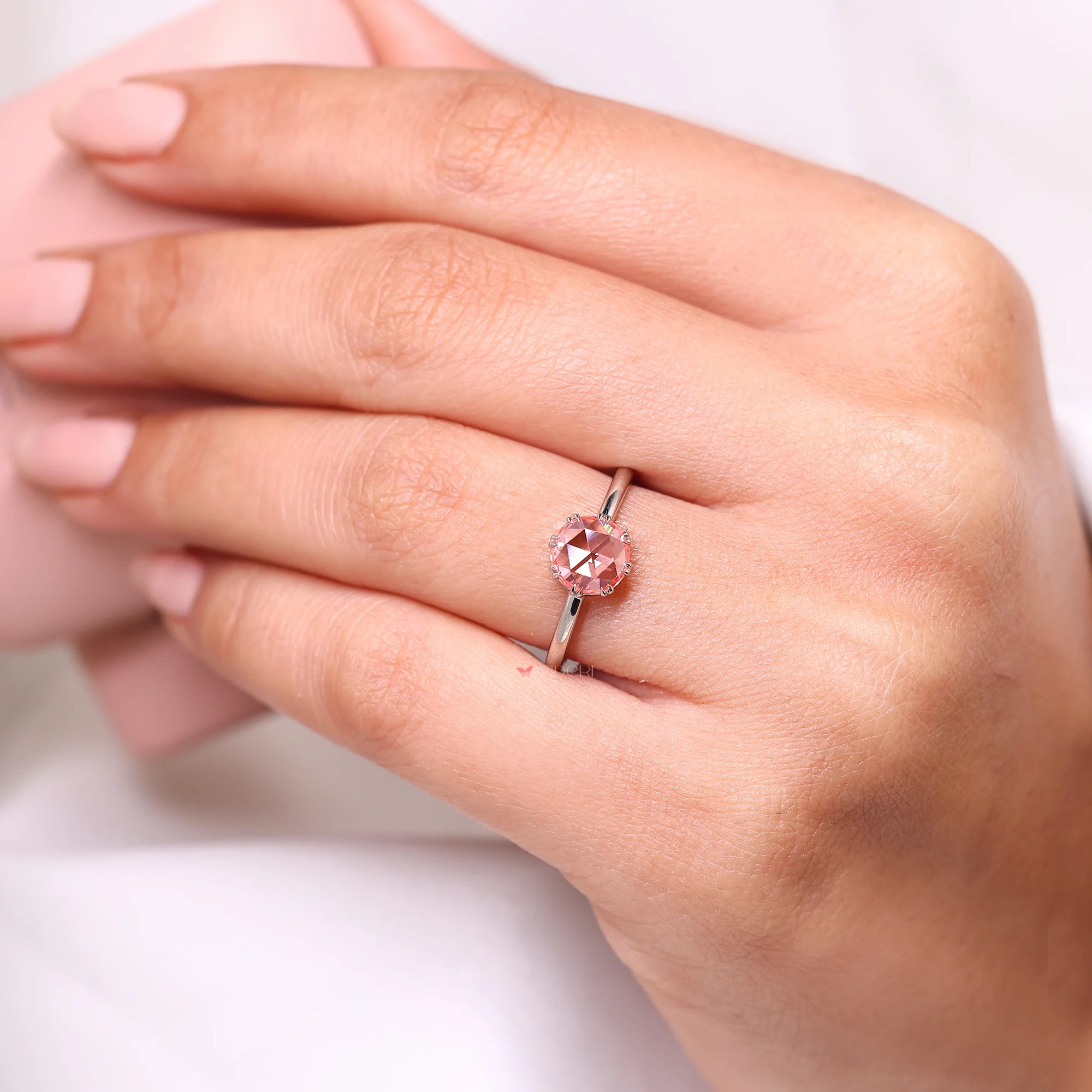 Double claw prong ring with pink diamond ring.