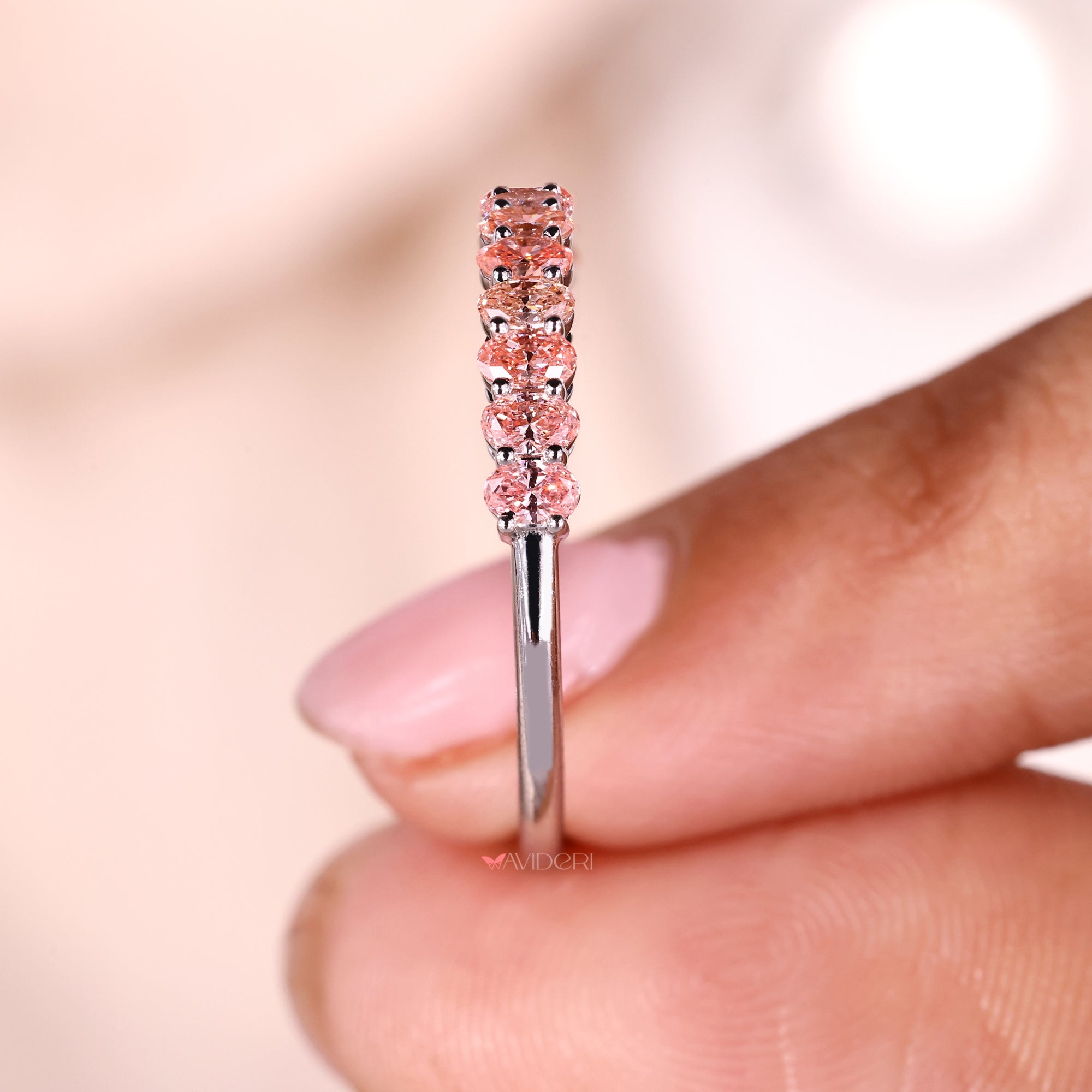 Half eternity diamond band featuring oval cut Lab Grown Diamonds.