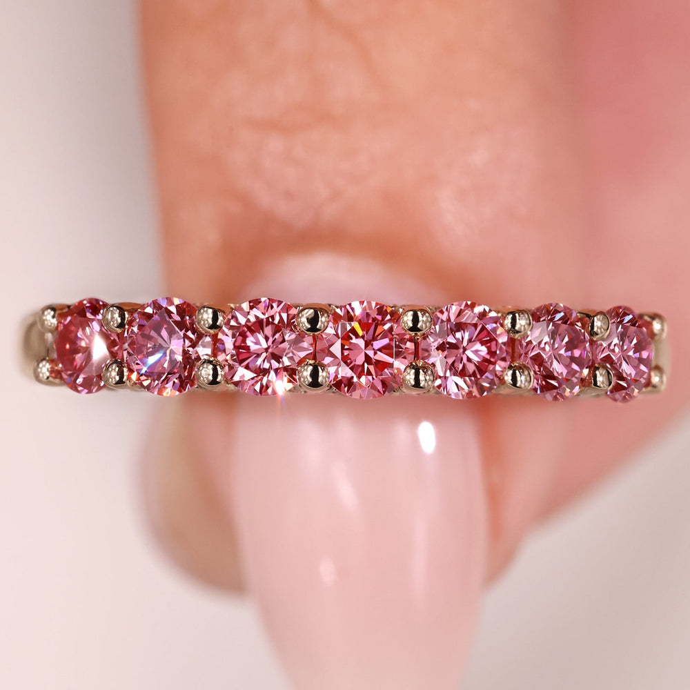 Diamond half eternity band in shared prong setting.