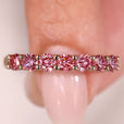 Diamond half eternity band in shared prong setting.