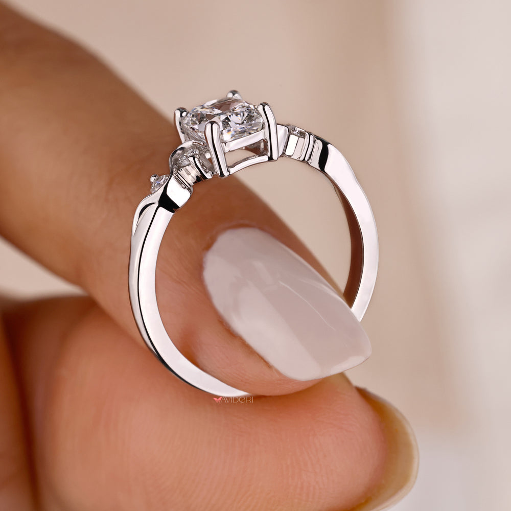 White gold engagement ring with an Avideri ring.
