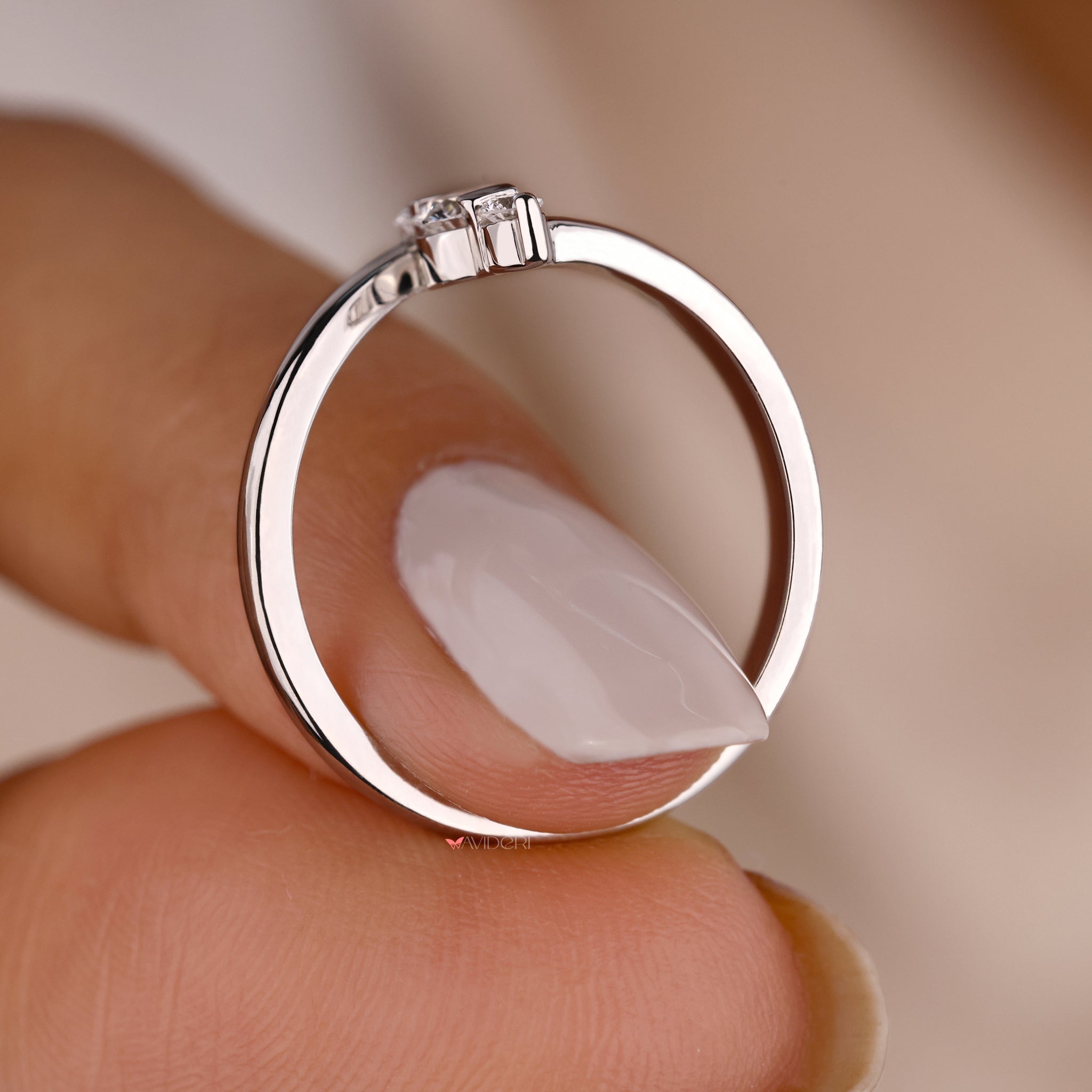 White gold and diamond ring with an Avideri engagement ring.
