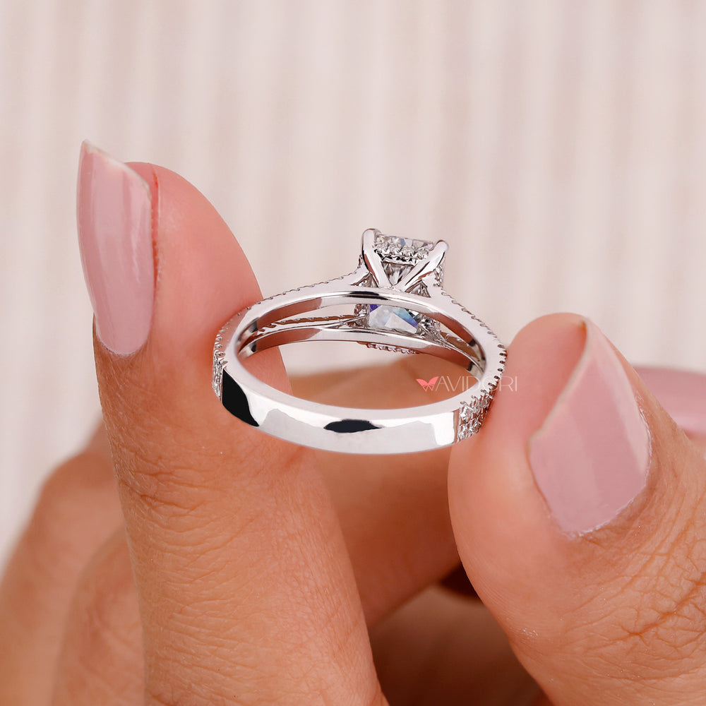 Hidden halo ring with a round engagement ring design for a modern touch.
