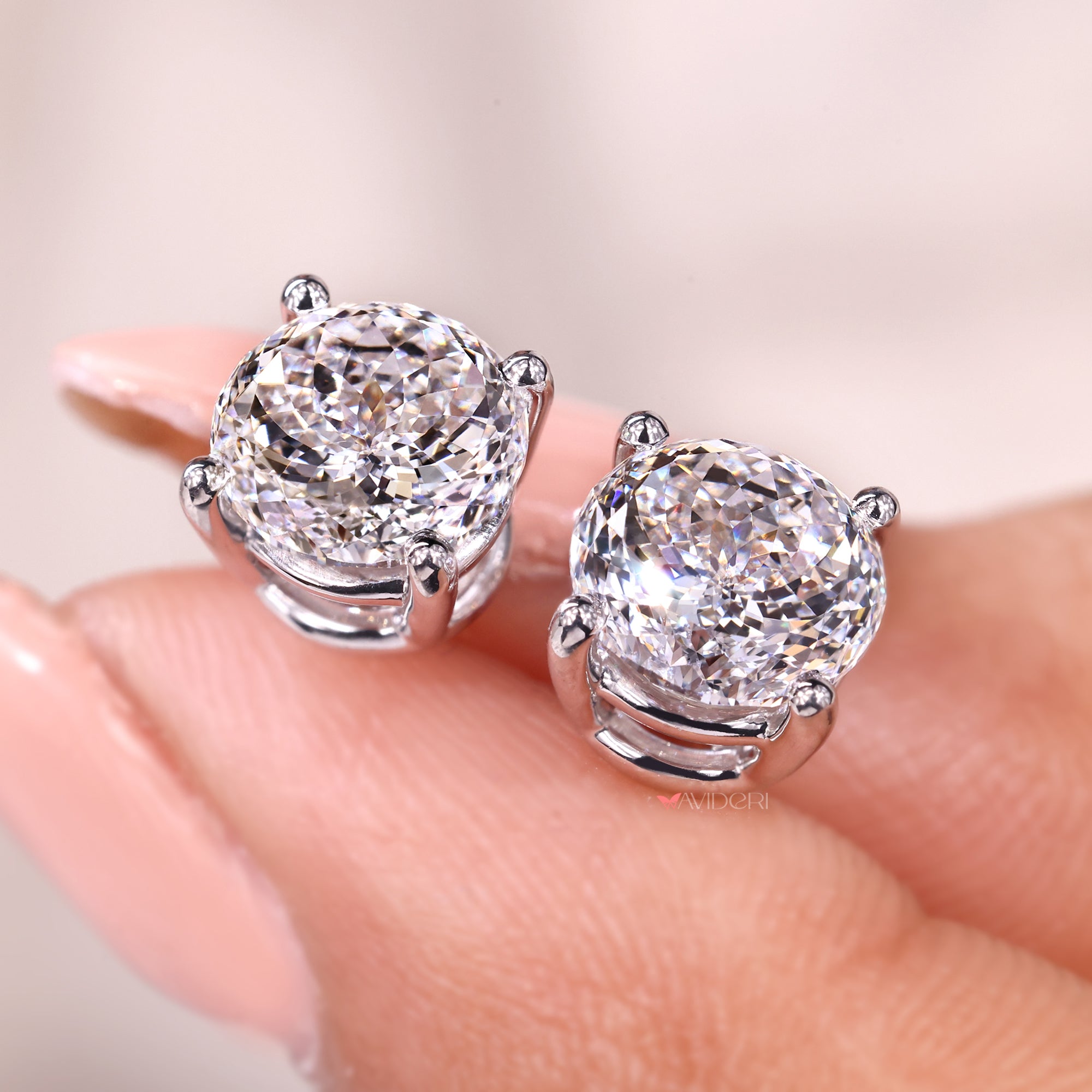 7mm Portuguese cut diamond earrings with prong set earrings.

