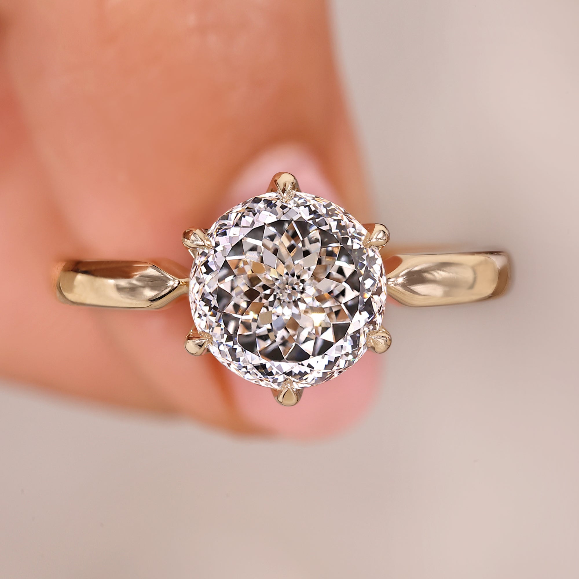 Portuguese cut diamond ring with solitaire setting in yellow gold.
