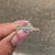 Lab grown round diamond engagement ring with cluster setting.