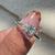 Avideri Engagement Ring with a pear-shaped diamond in a cathedral setting.

