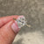 Marquise diamond ring with round side diamond accents.
