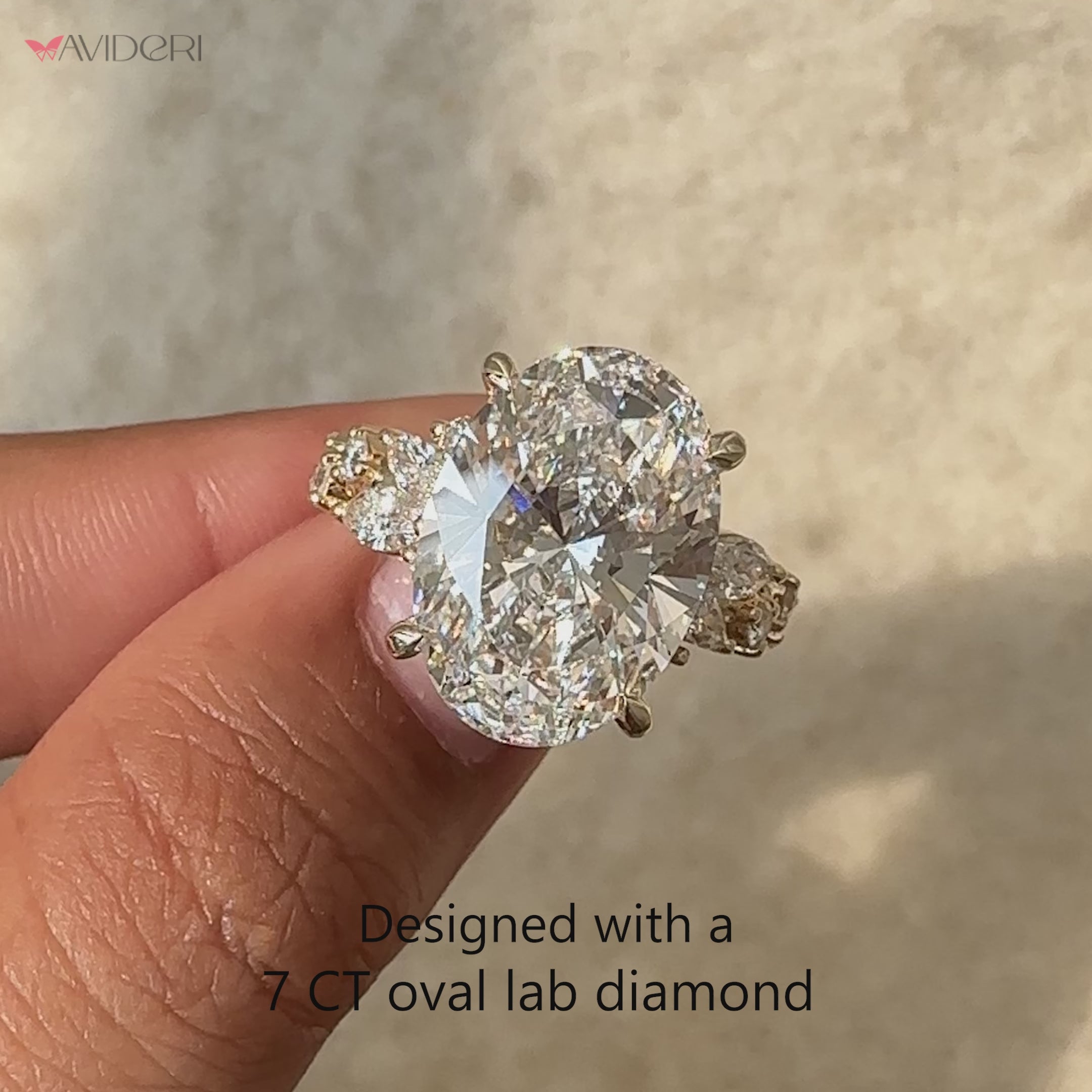 Handmade oval cut diamond ring with side stones.
