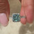 cyan blue princess cut engagement ring.