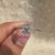 Avideri ring in white gold with marquise diamond and side stones.