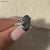 Elegant movel solitaire engagement ring featuring a brilliant center stone.
