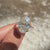 Oval cut diamond ring with pear side stones.
