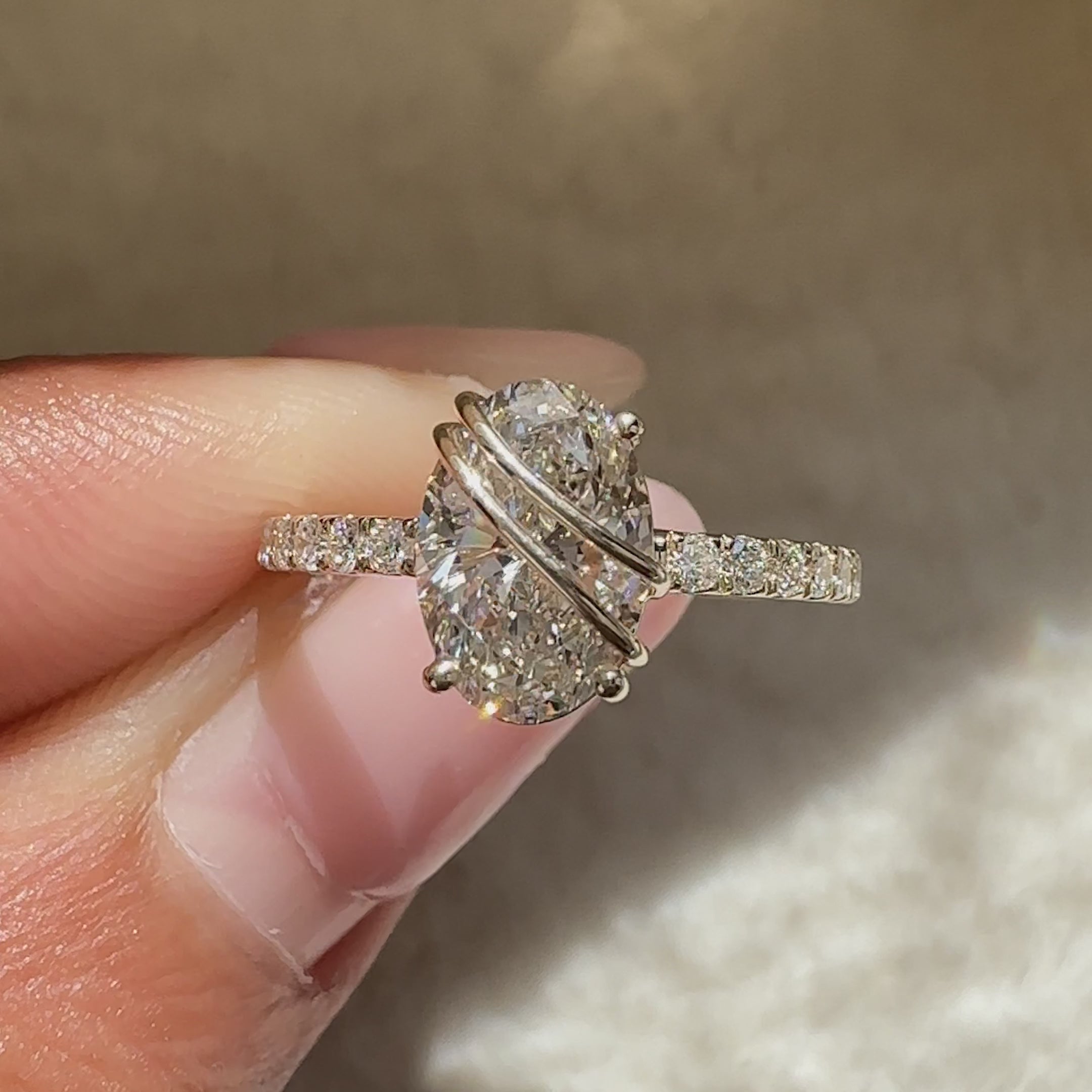 Regal style oval engagement ring with diamond pave.

