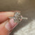 Regal style oval engagement ring with diamond pave.
