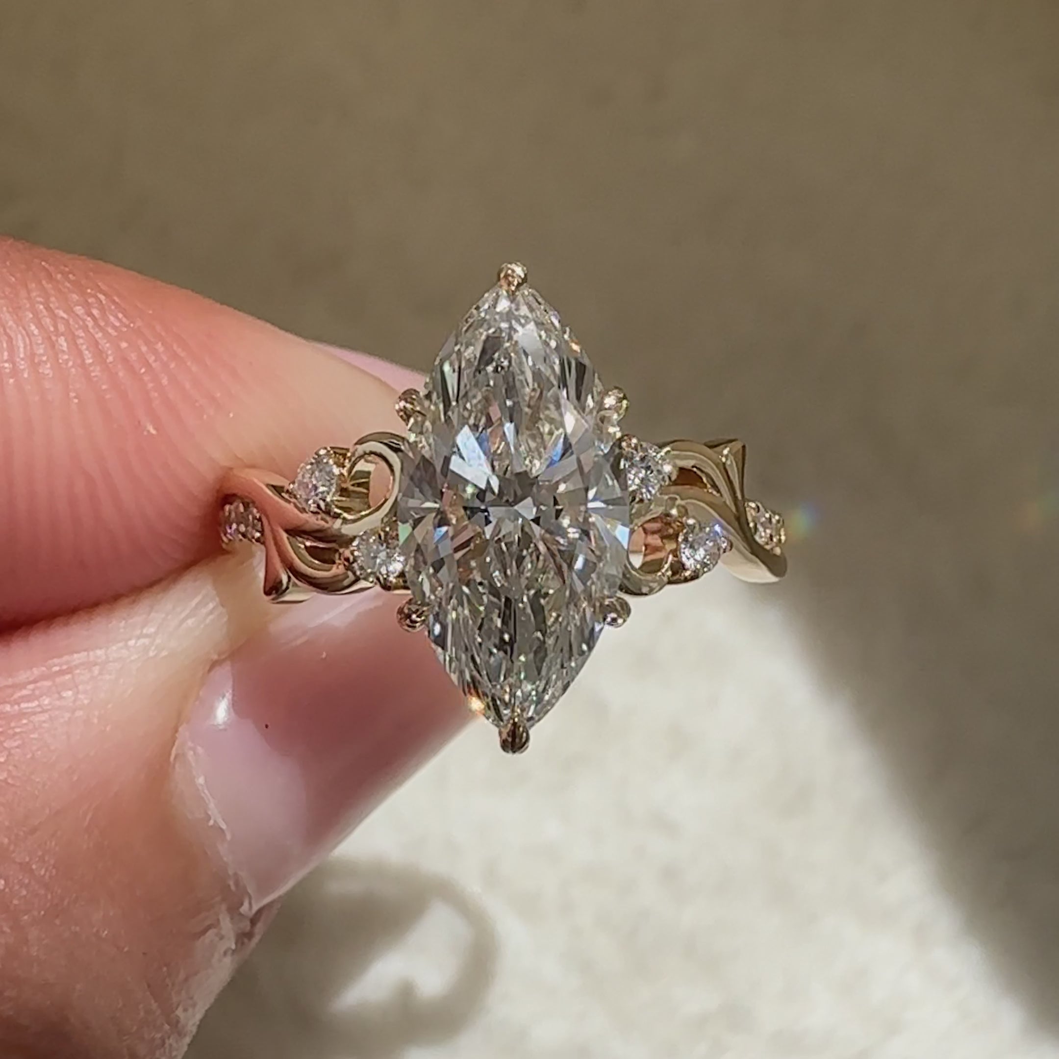 Lab grown marquise engagement ring with basket style setting
