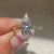 Open gallery marquise ring with milgrain setting.
