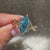 Handmade blue diamond ring with six prong.