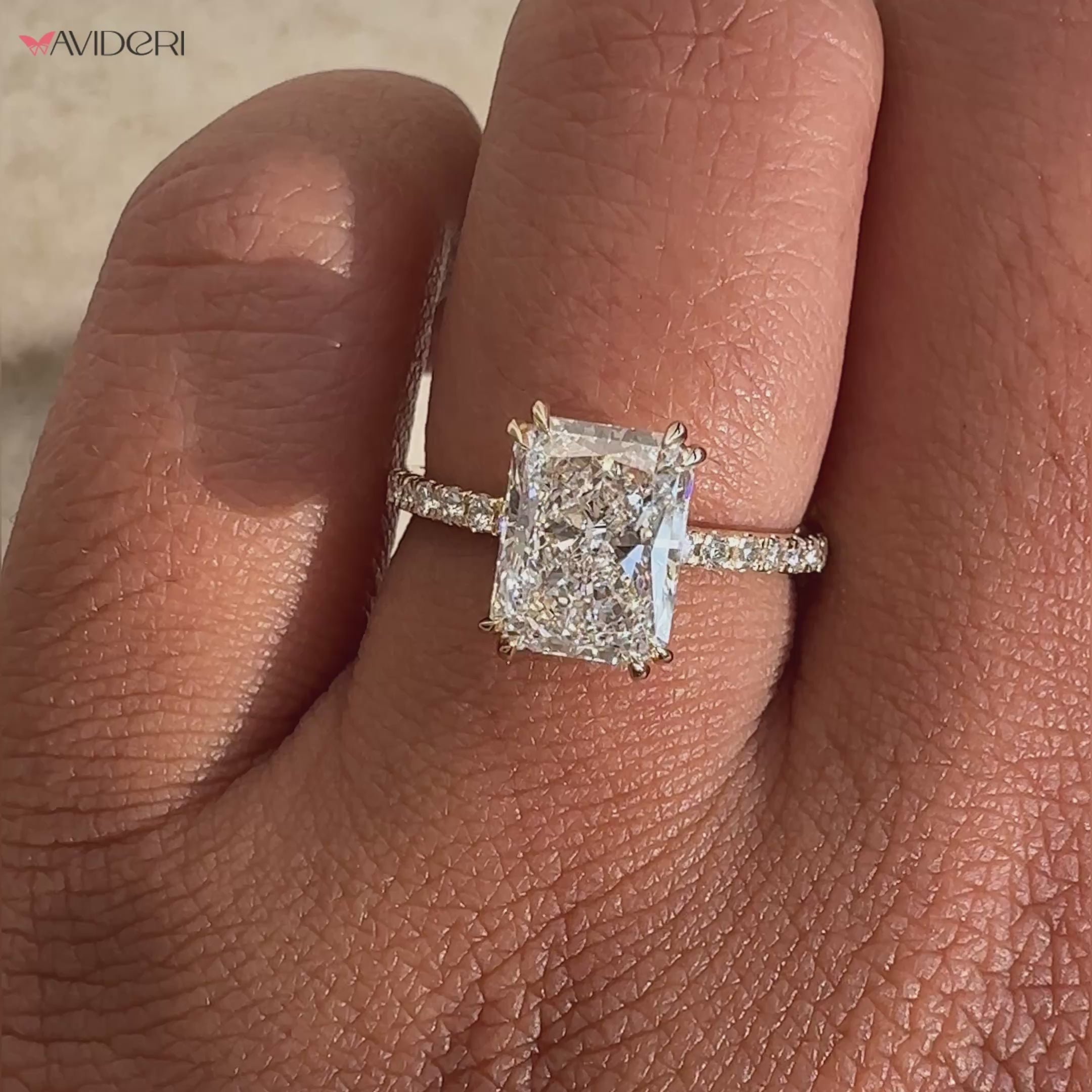 Radiant cut engagement ring with a modern pave wedding band.
