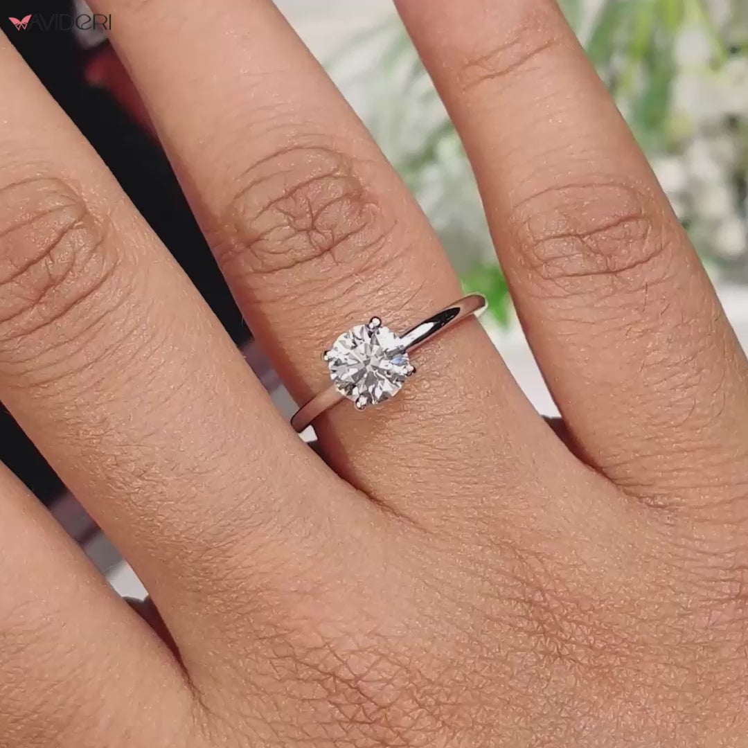 Round diamond engagement ring with a classic 4 prong diamond ring style for timeless elegance.