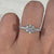 Anniversary gift for her, a round diamond ring with a pave setting for extra shine.
