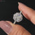 Halo cushion cut diamond surrounded by pavé diamonds, creating a dazzling centerpiece for a unique and elegant look.
