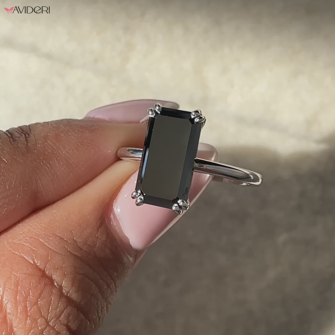 Solitaire emerald cut ring crafted in a classic prong setting
