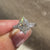 Basket setting marquise ring with baguette sides.
