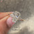 Coffin cut seven stone ring with round side stones.