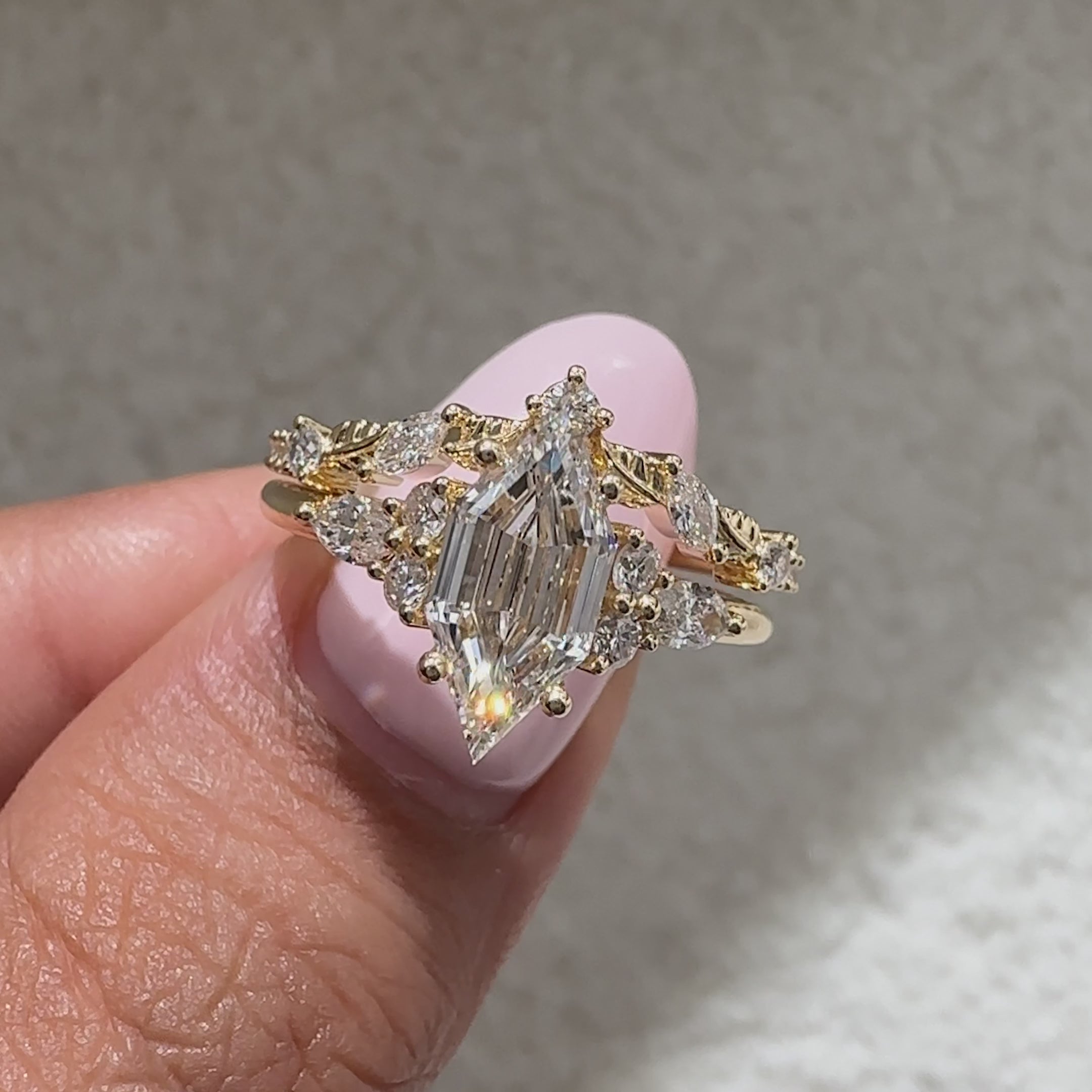 Hexagon diamond engagement ring with cathedral and muse style setting
