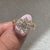 Hexagon diamond engagement ring with cathedral and muse style setting
