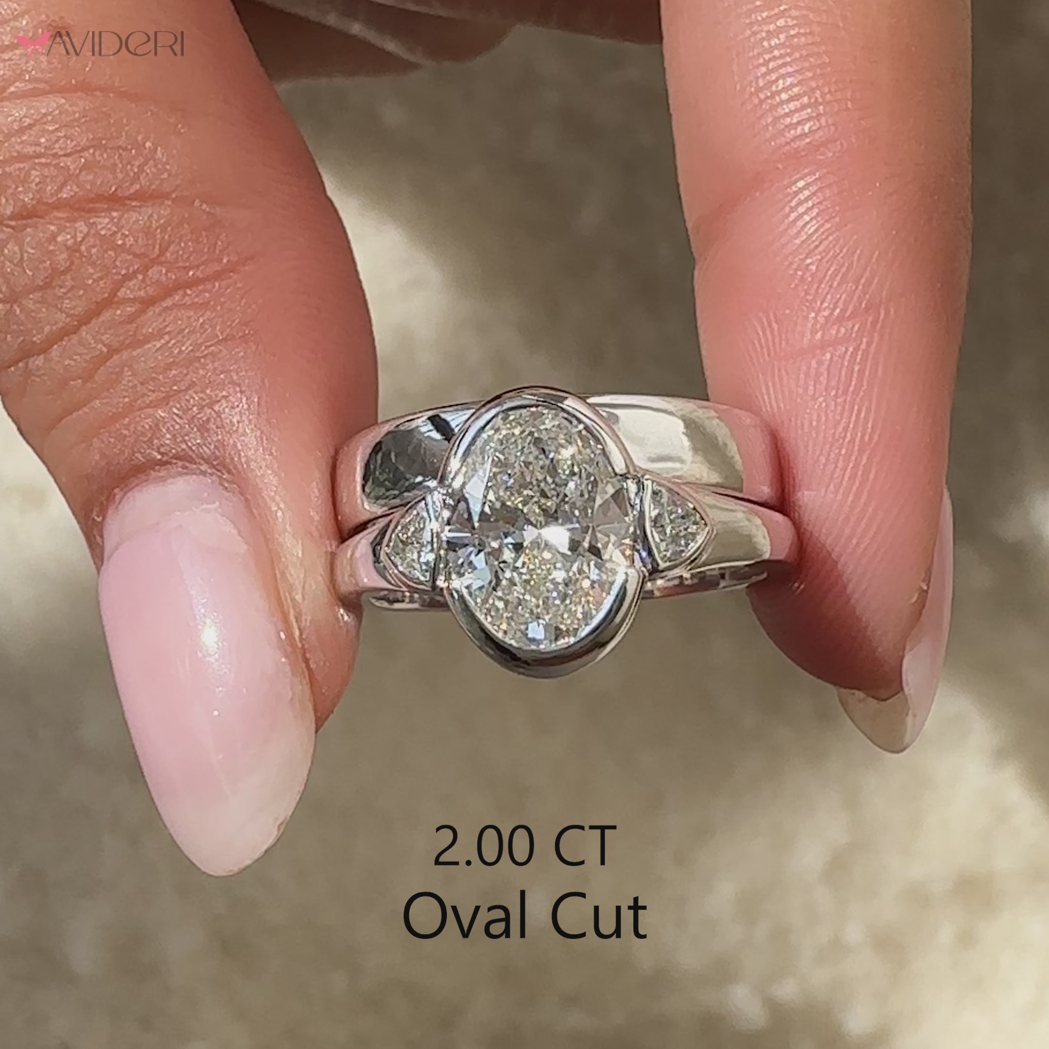 Trillion side stone ring with tapered shank white gold band.