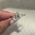 Pear cut lab grown diamond ring with round side stones
