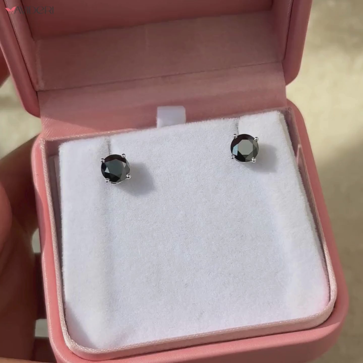 Black moissanite earrings in white gold setting for a bold statement.