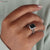 Avideri bridal set with an emerald cut moissanite ring for an elegant finish.