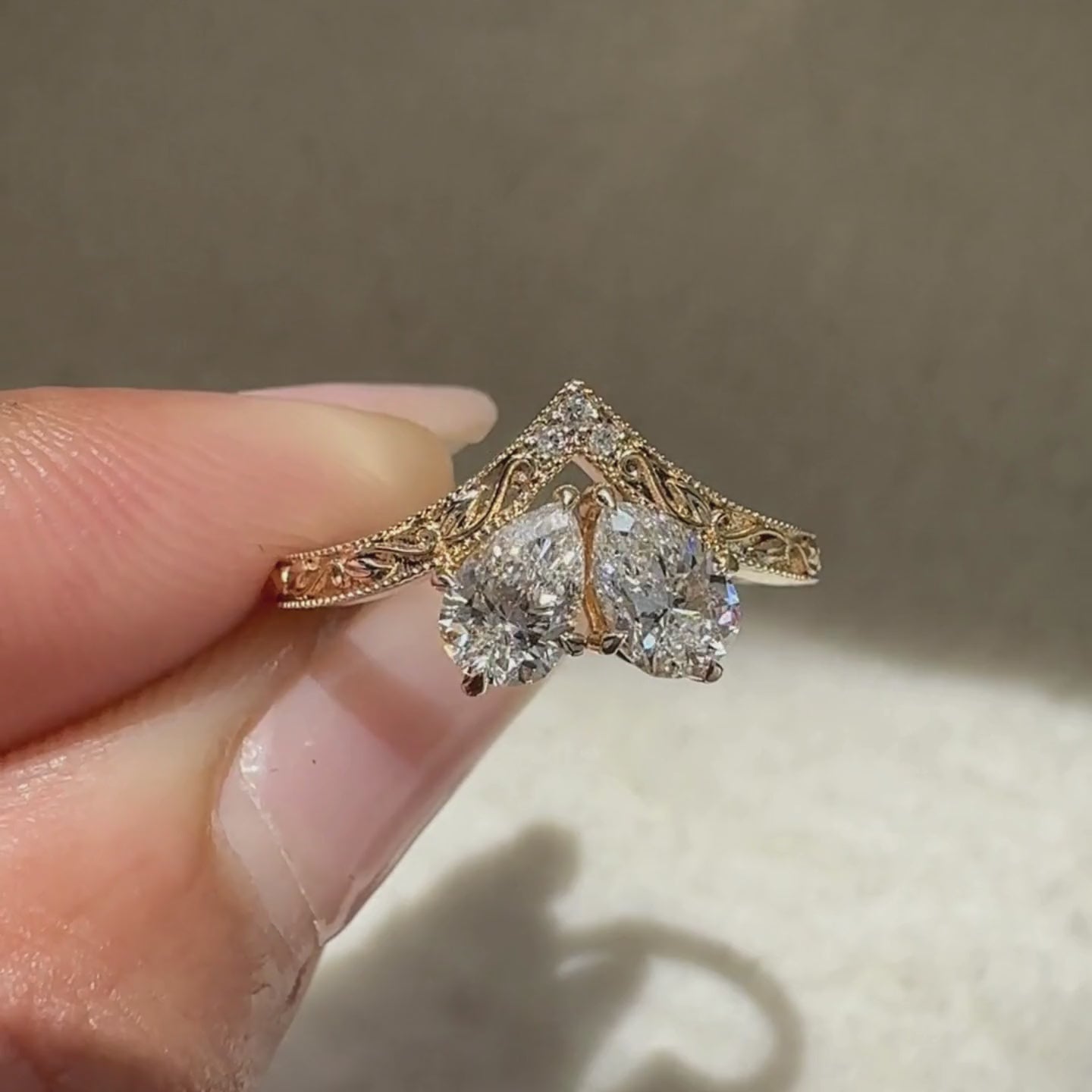 Vintage diamond ring with pear and round stones.

