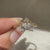 Vintage diamond ring with pear and round stones.
