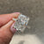 Handmade radiant cut diamond ring with secure prong setting.

