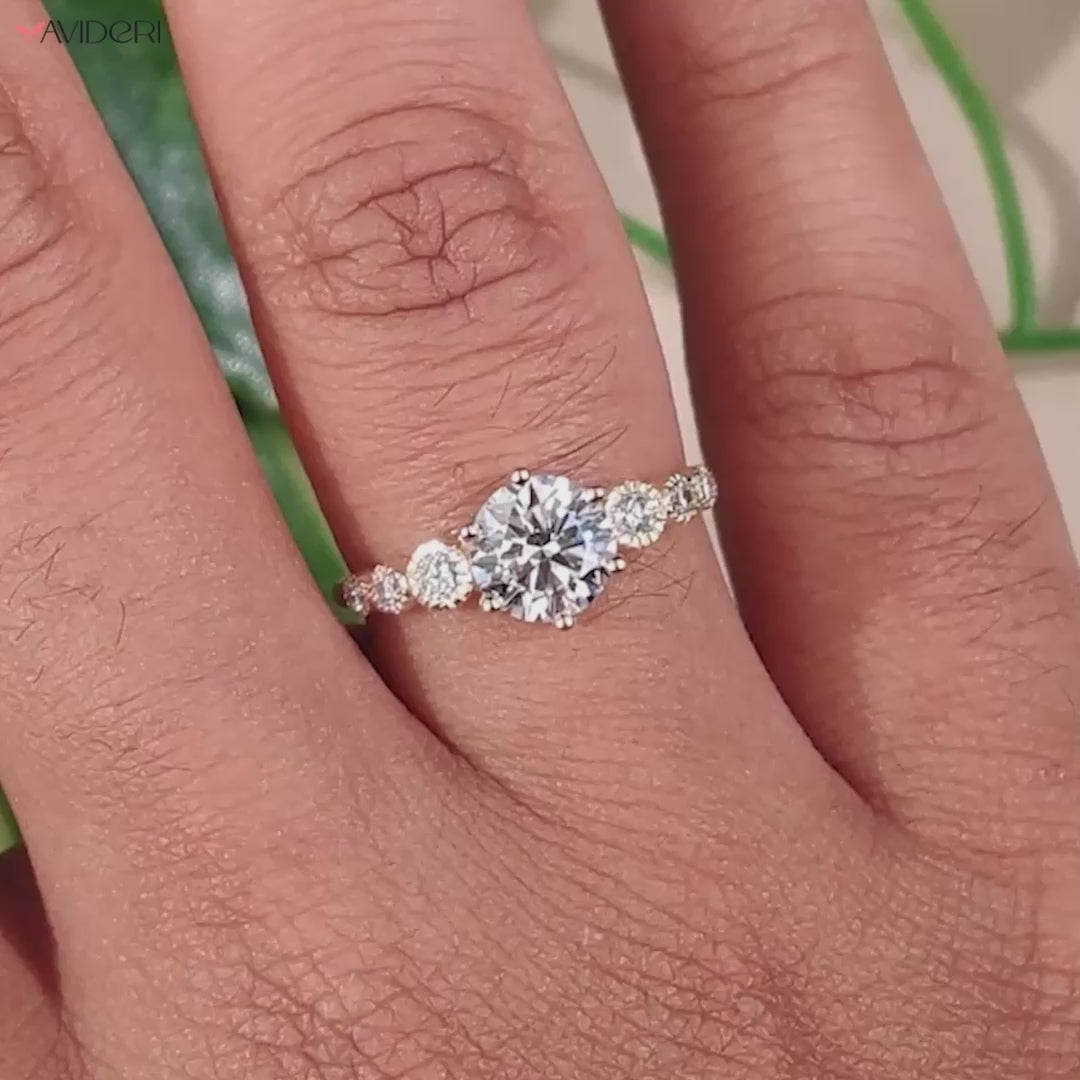 IGI certified round engagement ring featuring a tapered pave ring design for added brilliance and style.
