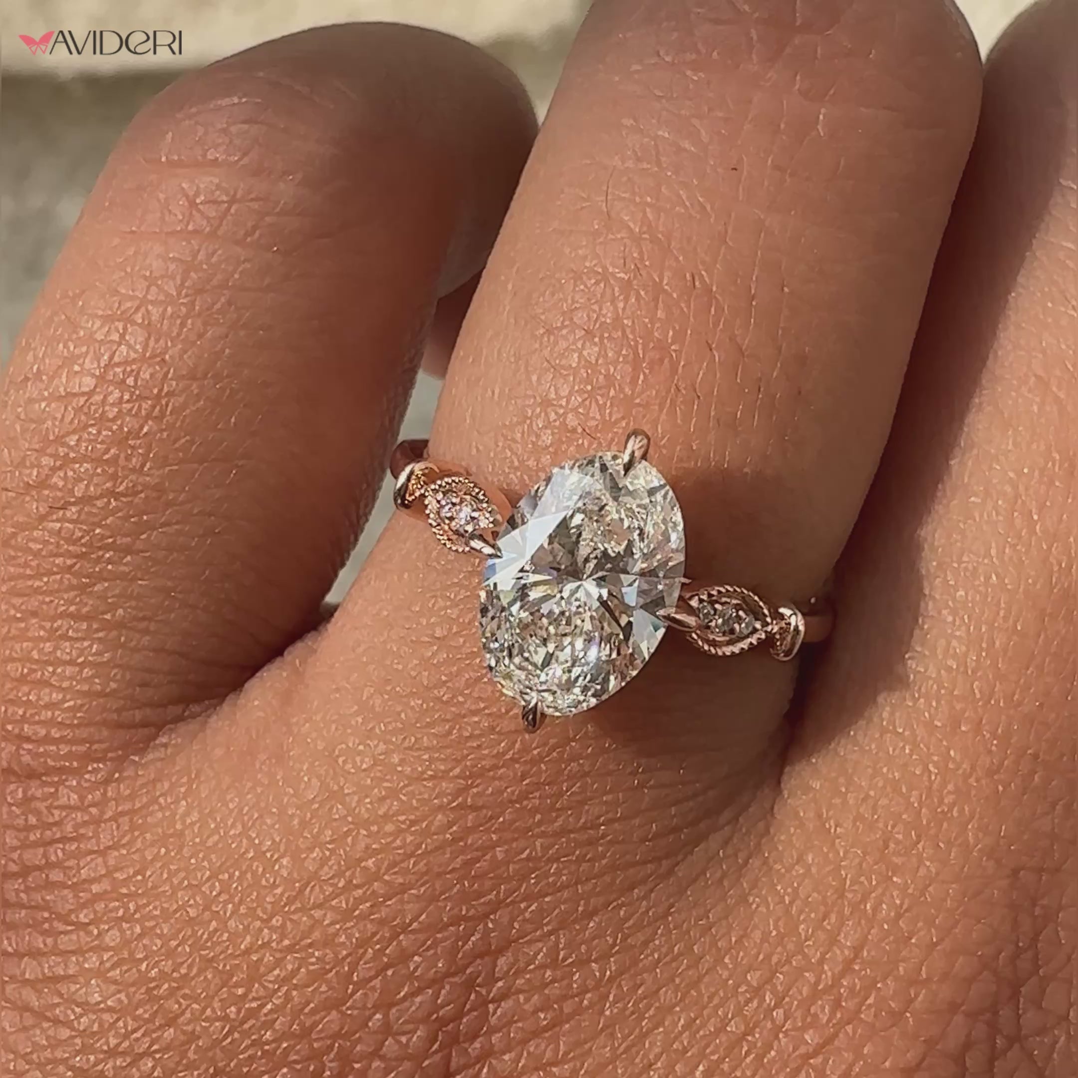 Antique engagement ring showcasing an oval cut diamond with milgrain detailing for a vintage-inspired, elegant look.
