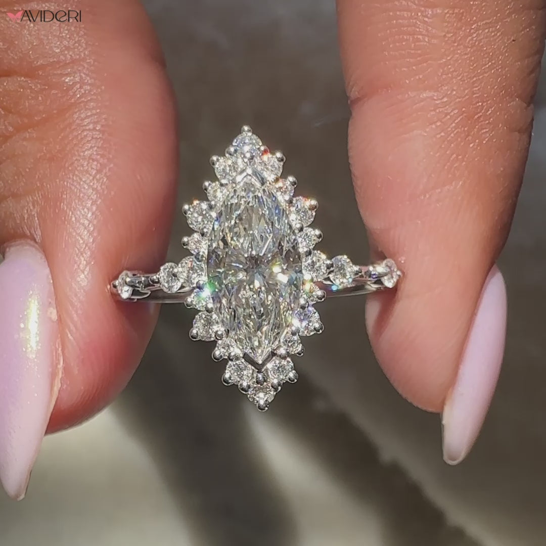 custom white gold engagement ring with round cut diamonds and distance pave band.