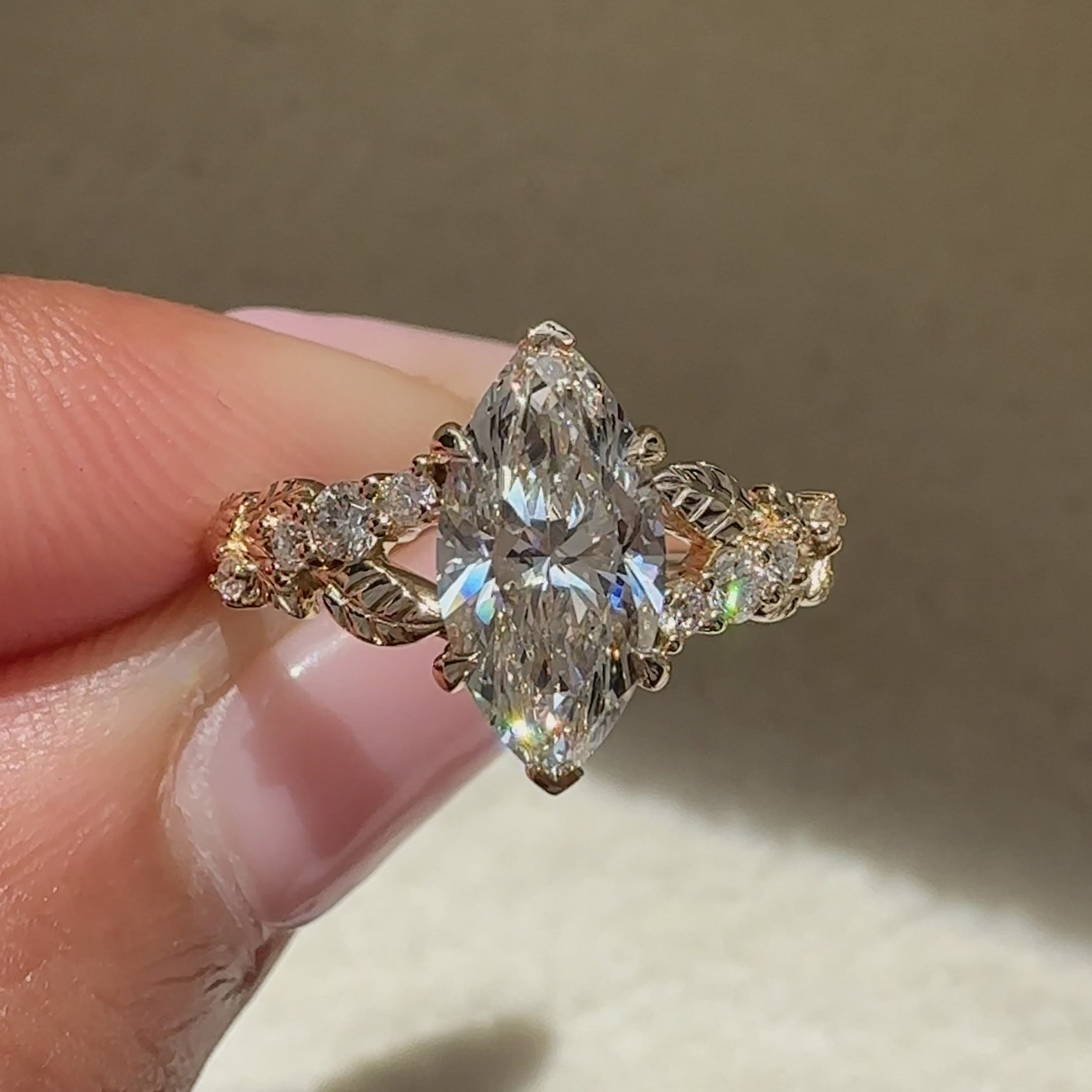 Handmade marquise ring with round side stones.
