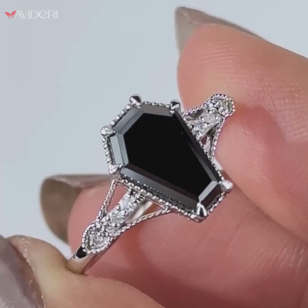 Coffin cut engagement ring featuring a unique, vintage-inspired style.
