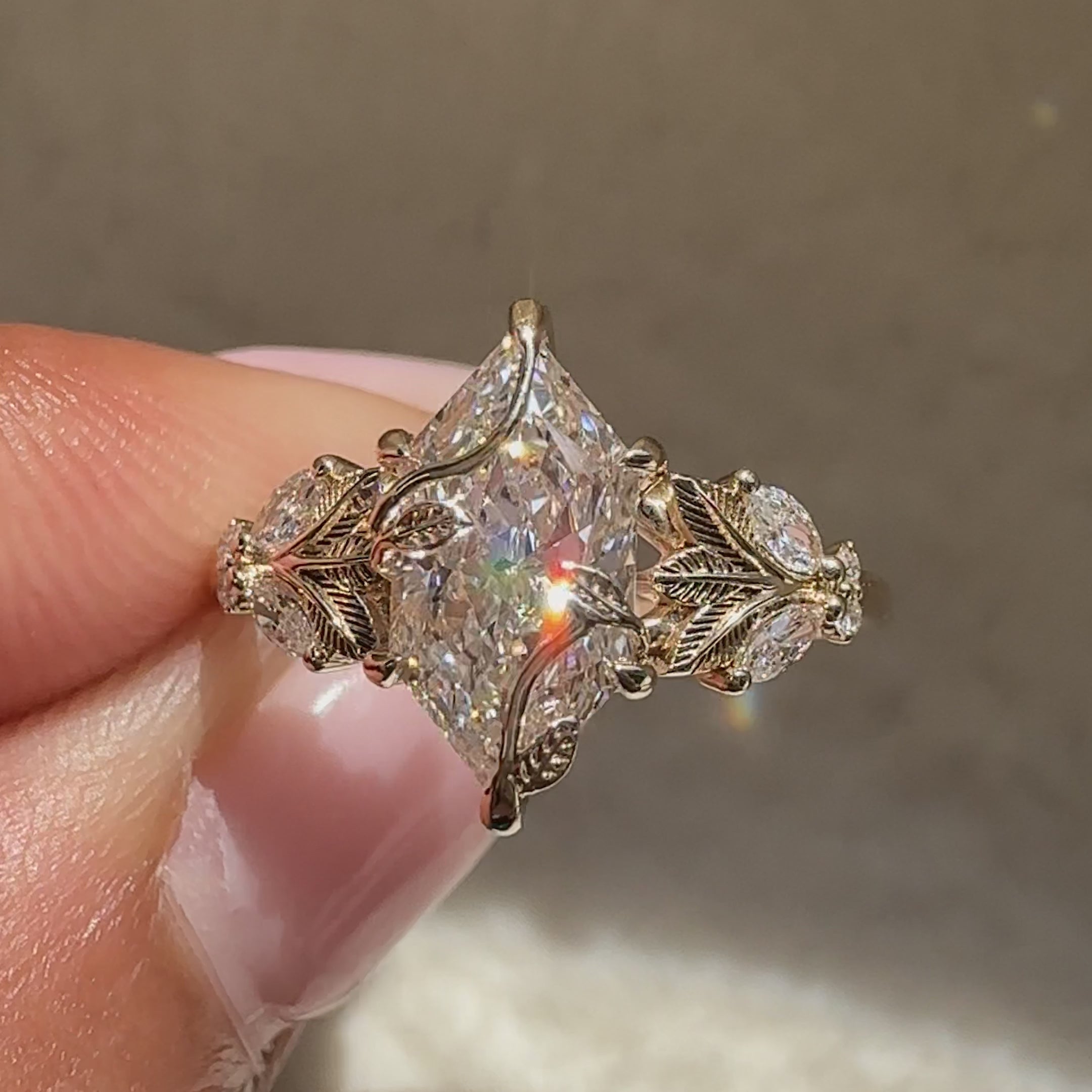 Fantasy marquise diamond ring with claw prongs.
