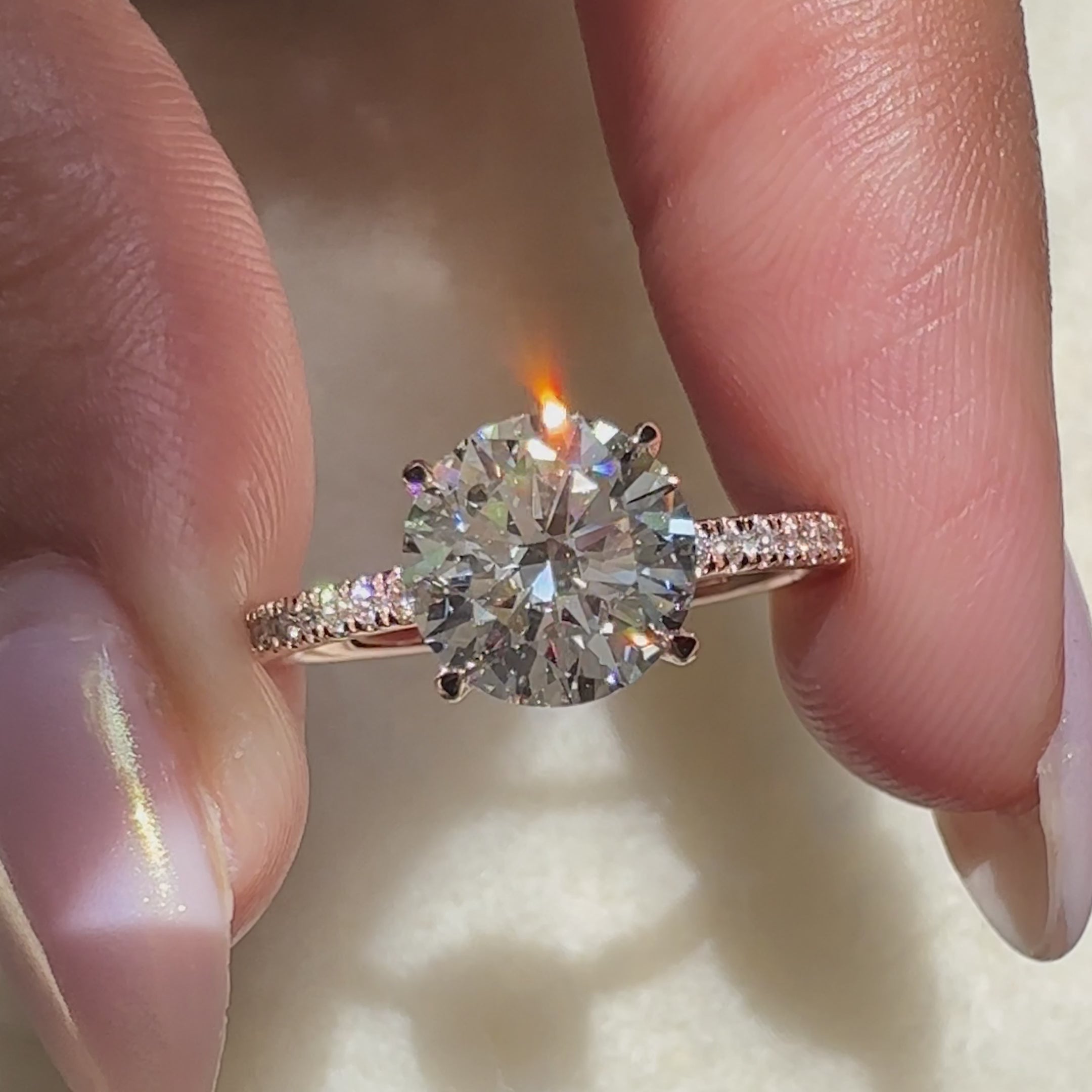 Rose gold engagement ring featuring round cut diamond engagement ring and open gallery ring.
