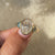 Avideri ring with bezel set oval diamond.