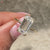 Emerald cut moissanite ring with clean silhouette.
