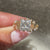 Princess cut diamond ring with side stones.