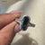 Bold avideri ring with black stone in a custom white gold band
