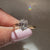 Cushion OEC diamond ring with four claw prong setting
